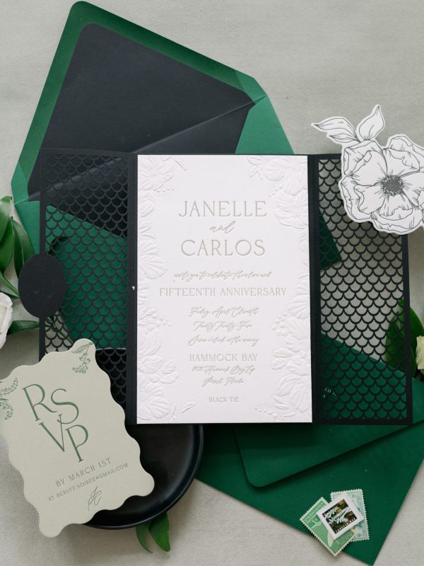 Sculpted embossed and letterpress wedding invitation with laser cut gate fold and die cut cards