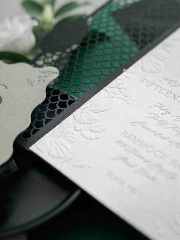 sculpted embossing and letterpress custom wedding invitation
