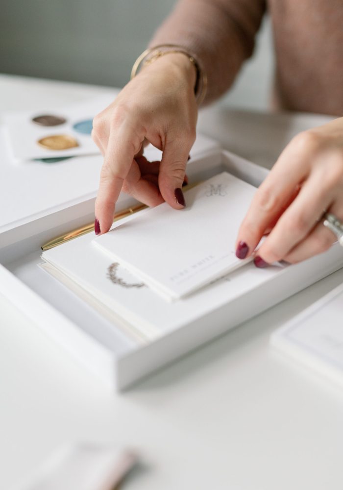 Sample pack of custom wedding invitations with letterpress, foil and envelope liner examples